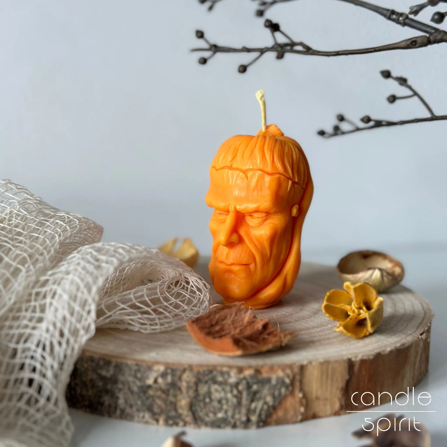 Pumpkin candle shaped like a zombie head - Halloween party decor, holiday home decor, and seasonal gift.