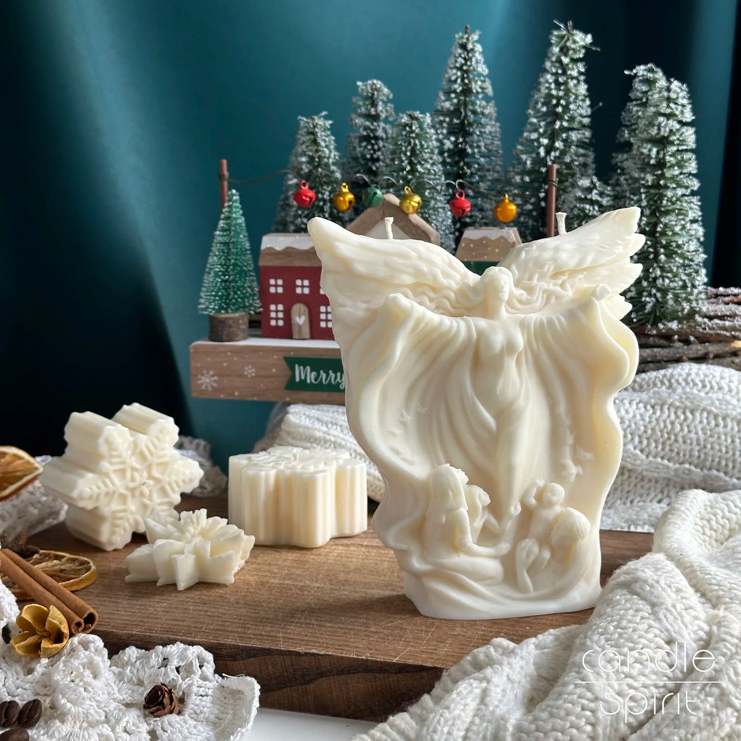 Scented white angel candle and snowflakes candles on a background with Christmas decorations - Christian gift for Easter, Christmas, baptisms