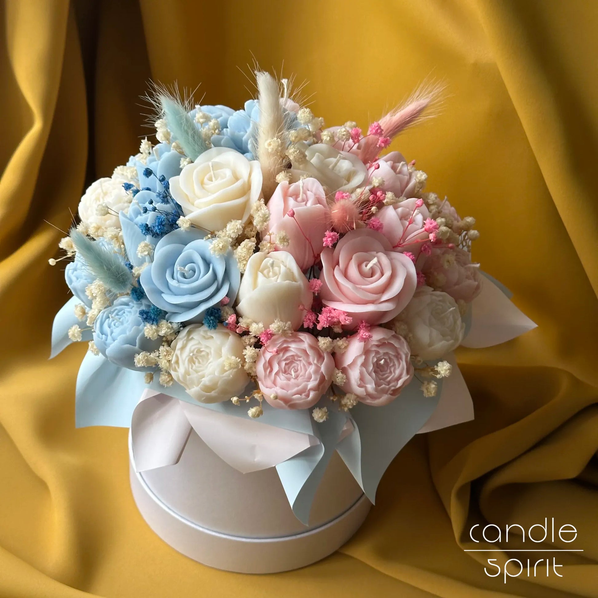 Large floral arrangement of pink and blue candle flowers for baby shower decor - bouquet for pregnant wife, new mom, sister, best friend.
