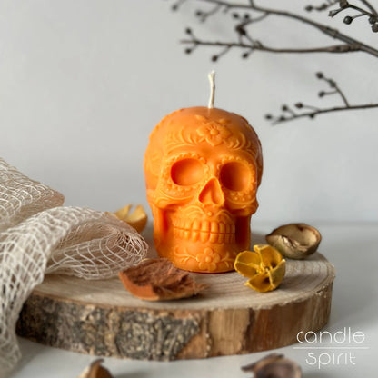 Scented orange floral skull candle on a fall decorations - Day of the Dead home decor and Halloween gift