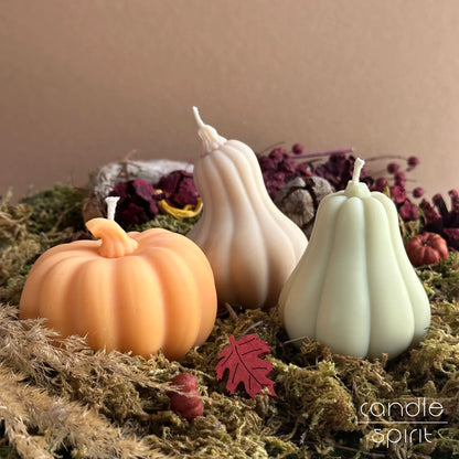 Three scented decorative pumpkin candles on moss -  cozy fall decor, Thanksgiving table centrepiece