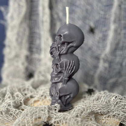 Scented gray human skull pillar soy candle on Halloween decorations - small birthday gift for rockers, bikers, and gothic lovers.