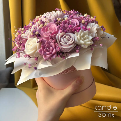 Candle bouquet of pink, white, and purple flowers held by a person - romantic wax anniversary gift for a wife