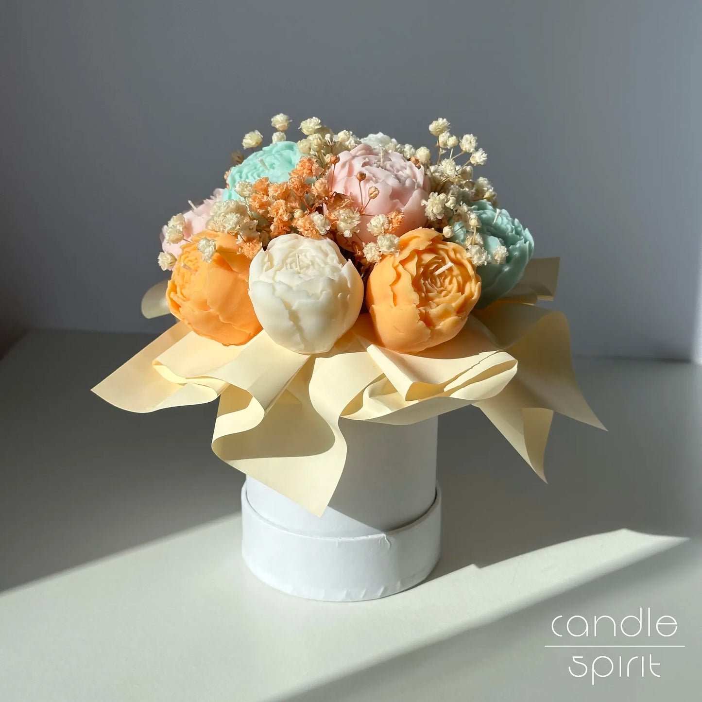 Pastel flower bouquet of peony candles in a white box - seasonal Easter decor, spring birthday gift.