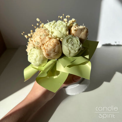 Bouquet of pastel pistachio and beige peony flowers in a white flower box - spring birthday gift for her.