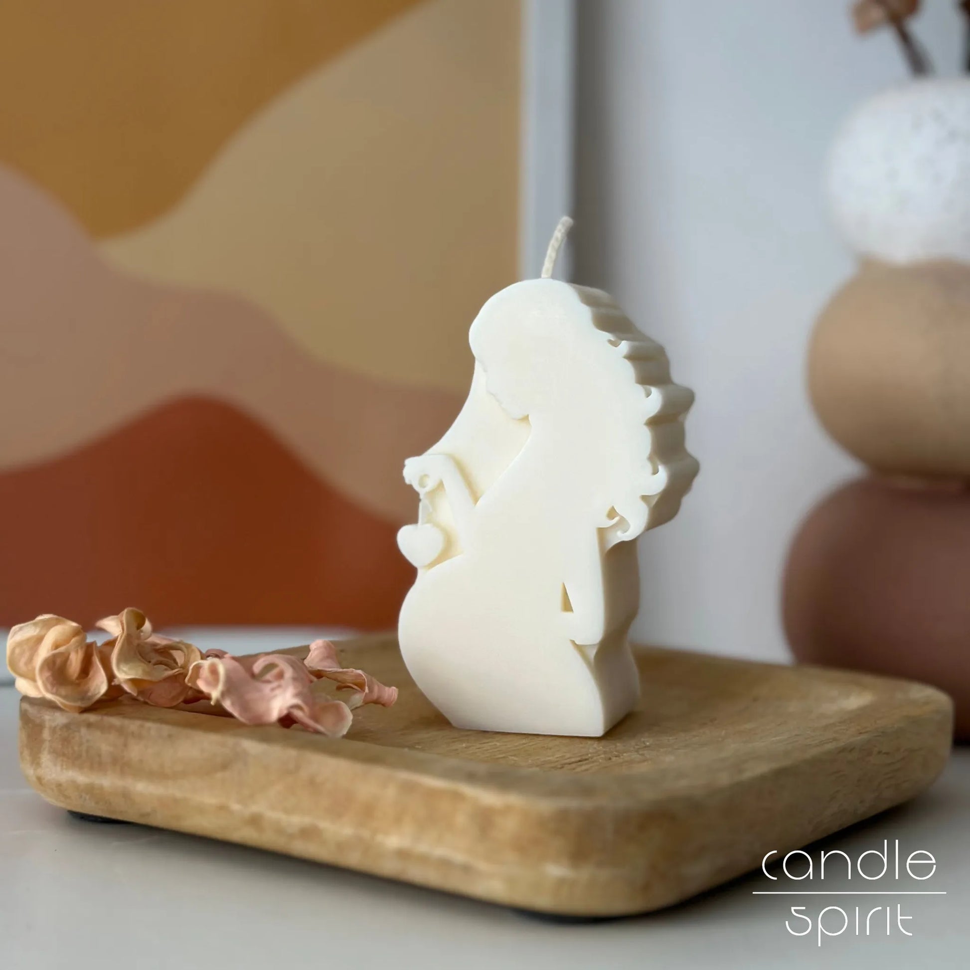 White scented pregnant woman candle -  a pregnancy gift for new moms. Neutral nursery and gender reveal party decor & pregnancy announcement present.