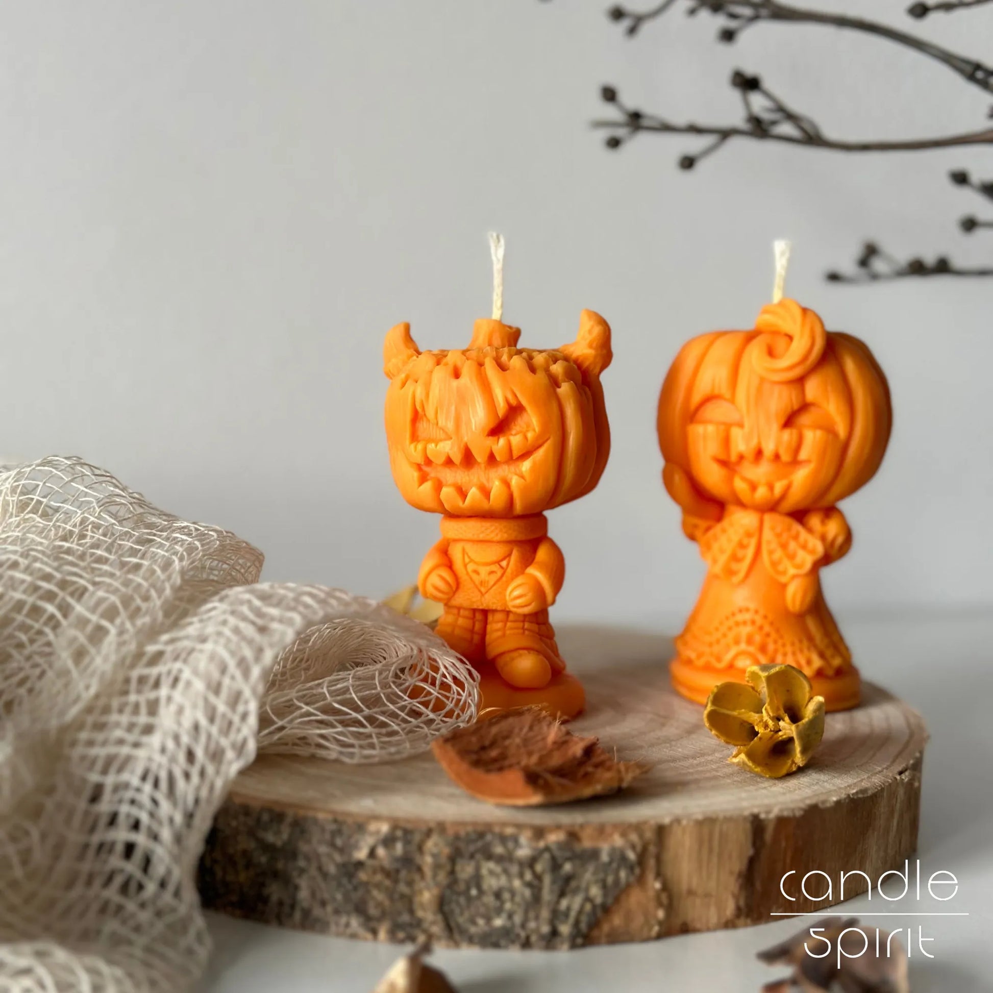 Two orange pumpkin candles - cute Halloween decor, fall wedding favors, spooky birthday presents, and unique autumn wax anniversary gifts for couples.