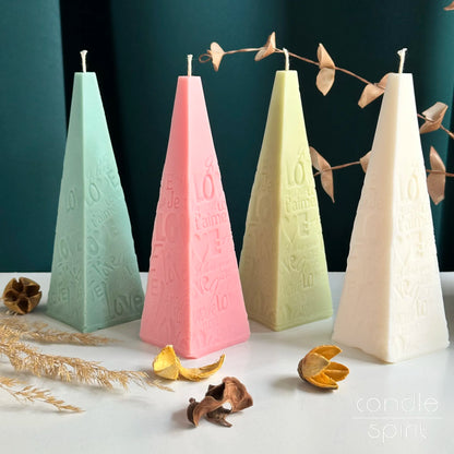 Four pyramid candles in pastel colours - unique Mother's Day gifts for moms, partners, girlfriends, sisters.