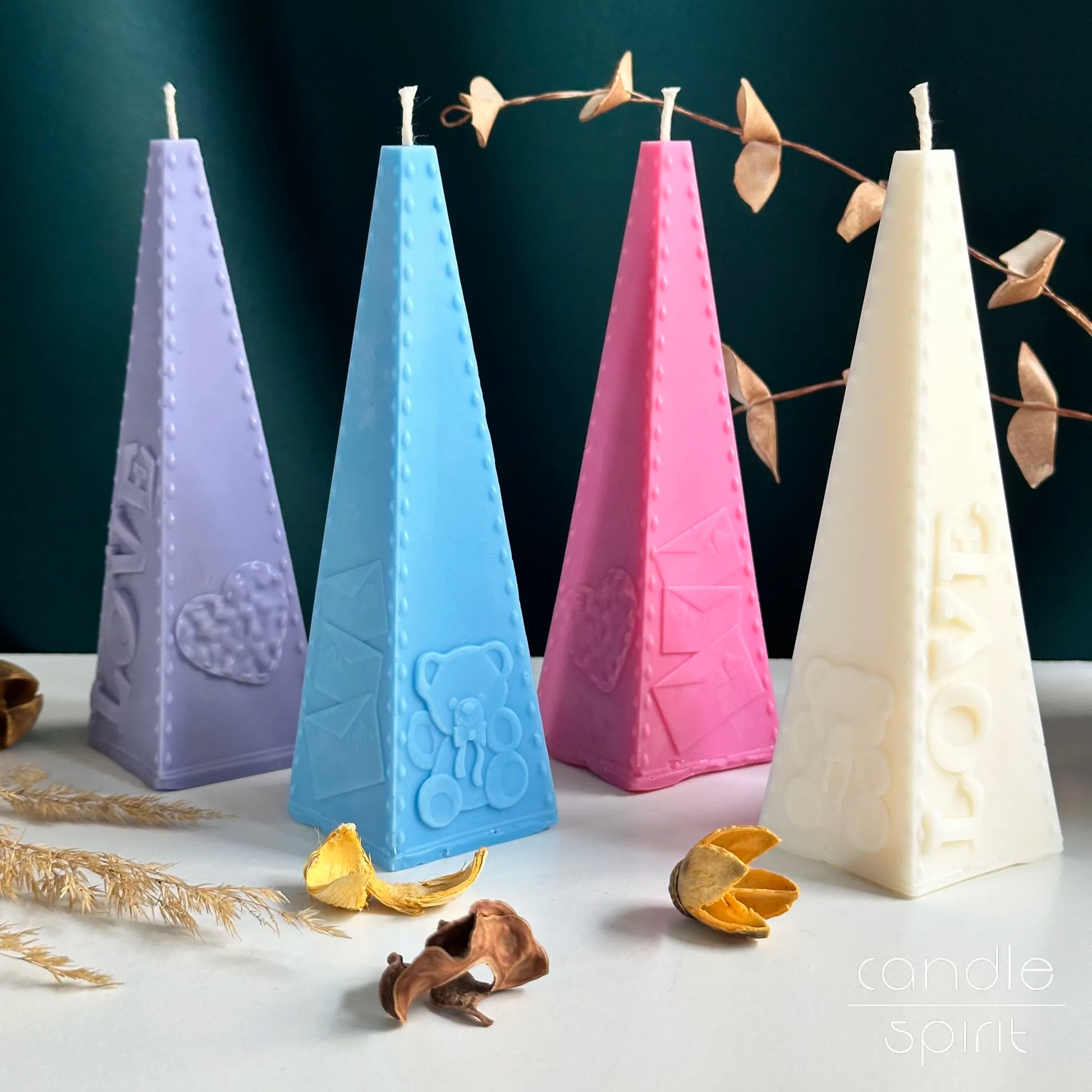 Four pyramid candles in pastel colors - romantic Valentine's Day gifts, wax anniversary presents for wife, girlfriend, partner.