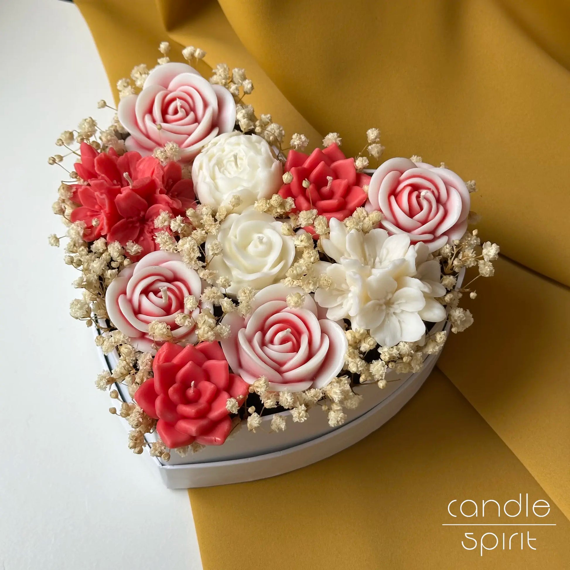 Heart-shaped arrangement of red, pink, and white flower candles - romantic Valentine's Day gift for her