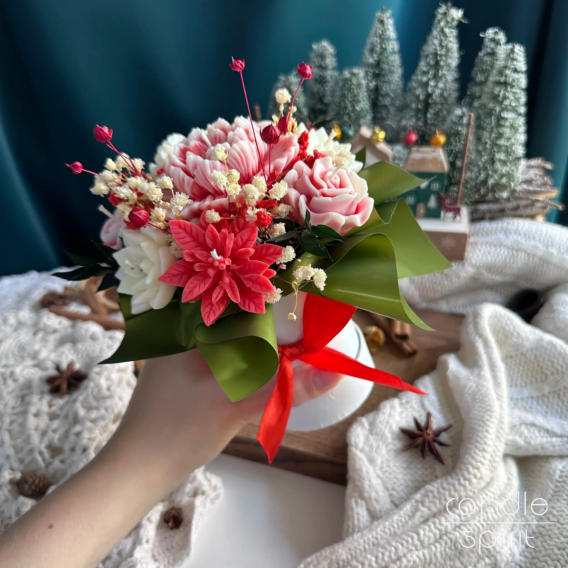 Scented bouquet of Christmas candle flowers in a white box with a red ribbon - seasonal corporate Christmas gift for employees, clients, business partners.