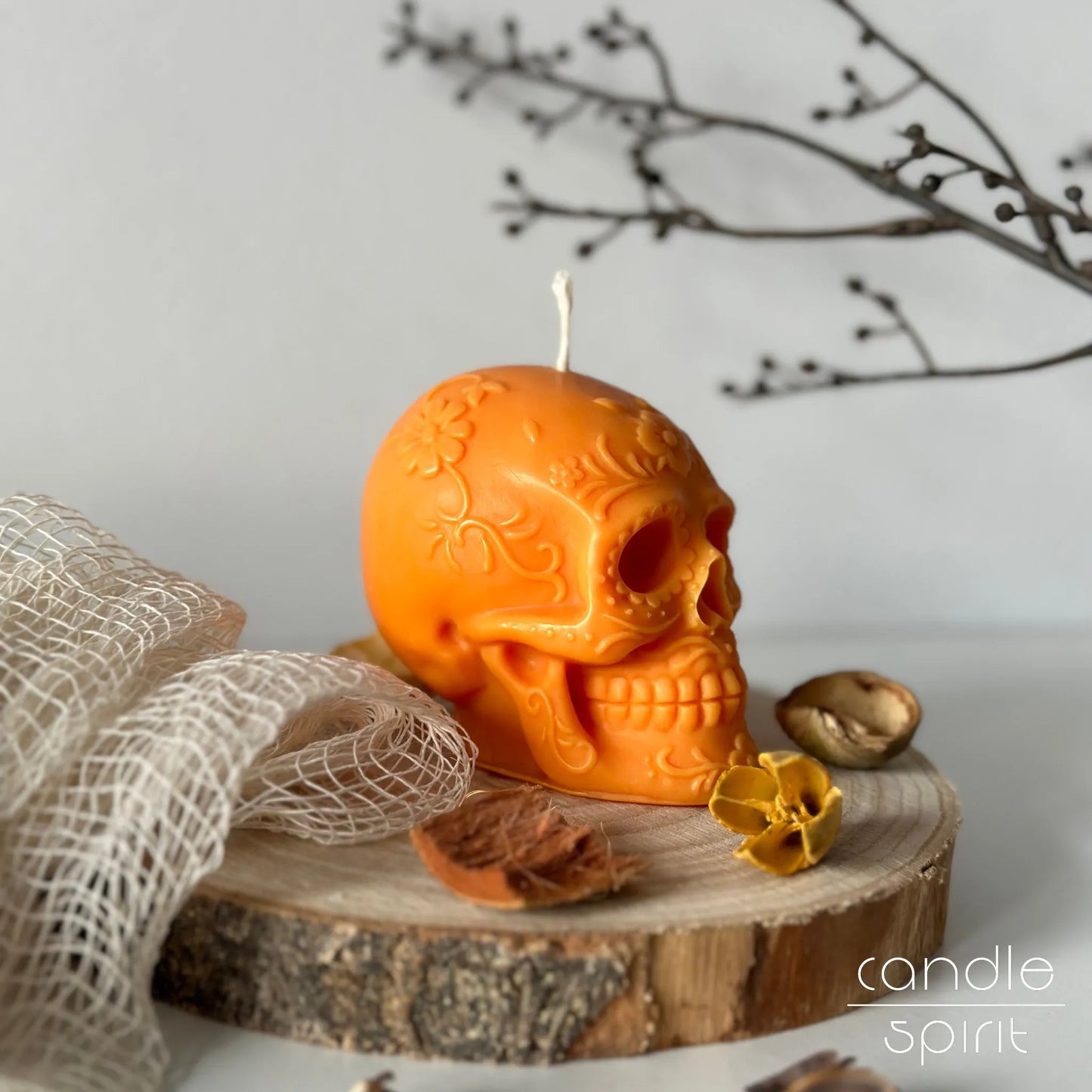 Scented orange floral skull candle for Dead of the Dead home decor - unique Halloween gift and fall decoration