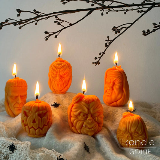 Scented Halloween pumpkin candles with carved faces with spider decorations - Halloween home decor