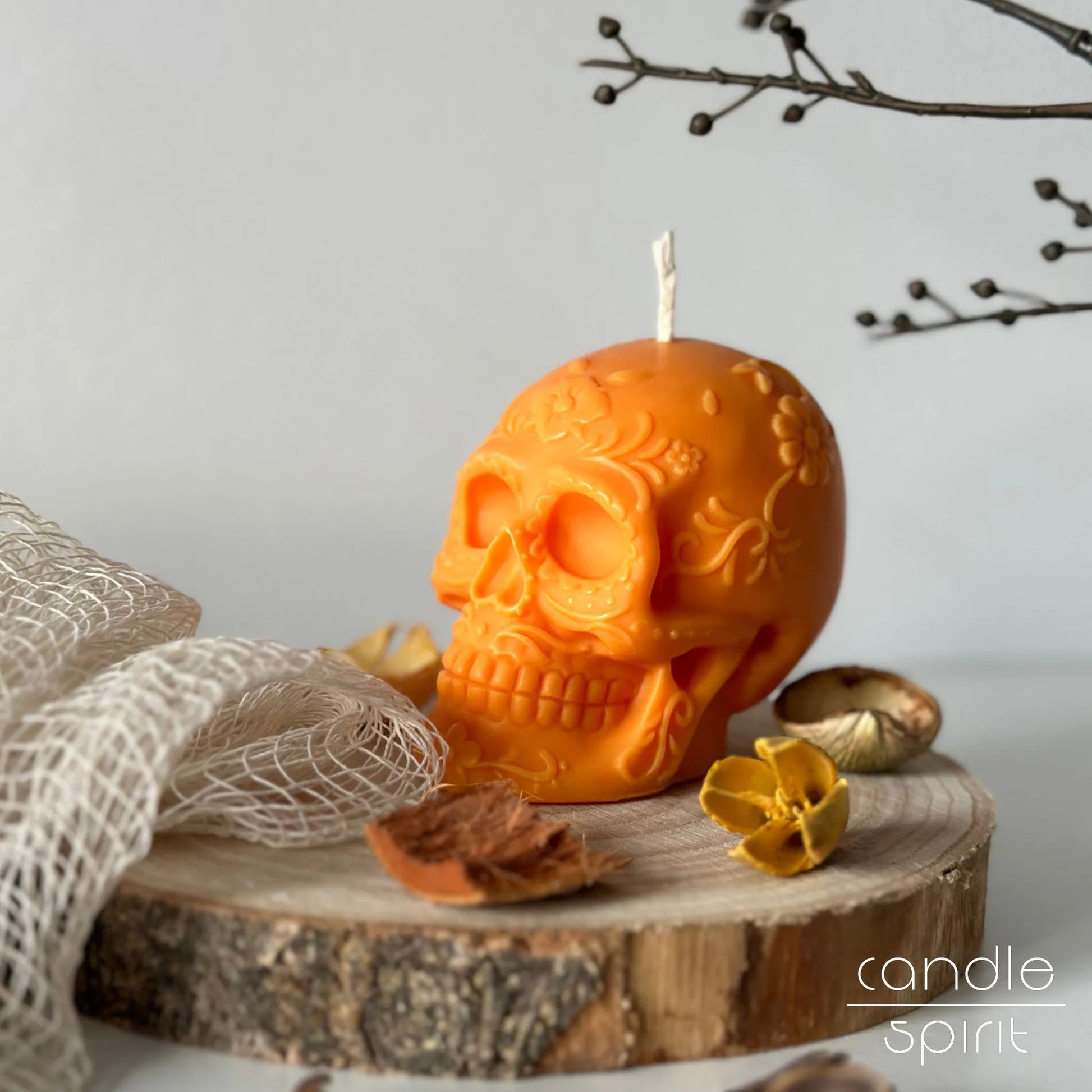 Scented orange floral skull candle with decorative elements - Halloween home decor and Day of the Dead gift for him