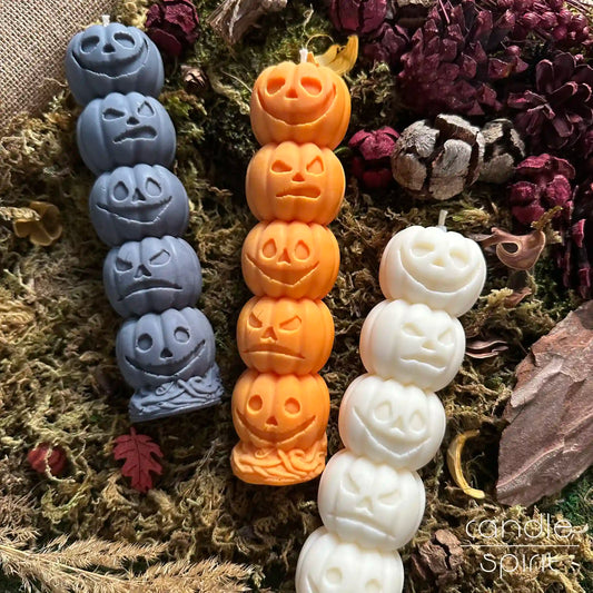 White, gray, orange scented pumpkin pillar candles - spooky Halloween decor, trick-or-treat party centerpiece, scented fall candle and autumn gift for holiday hosts, friends, and coworkers. 