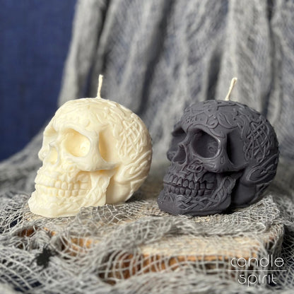 Two scented celtic skull candles, one white and one grey, on a Halloween decorations - Christmas gift idea for him